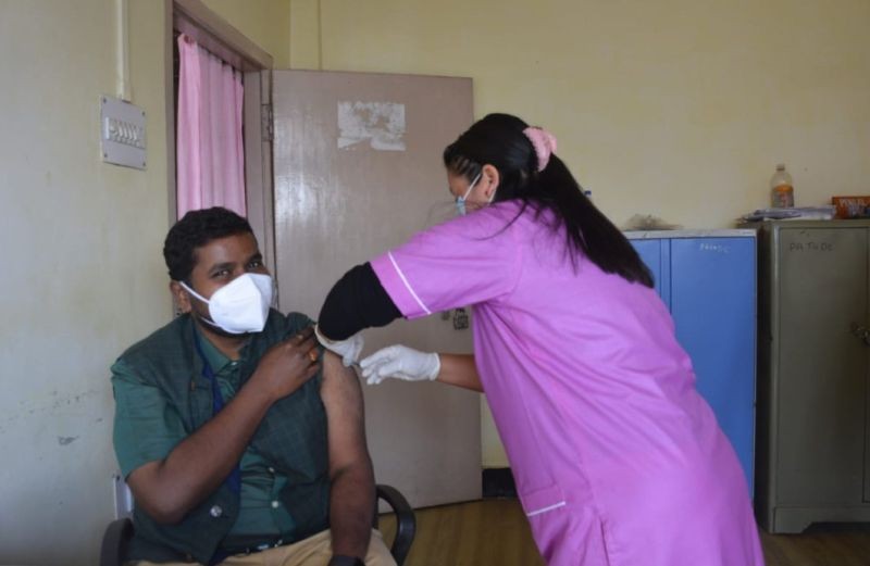 DC Mon Thavaseelan K, IAS being administered the first dose of vaccine in the Office of DC, Mon on February 8. (DIPR Photo)